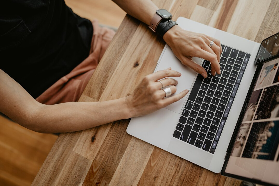 mystery writer typing at desk