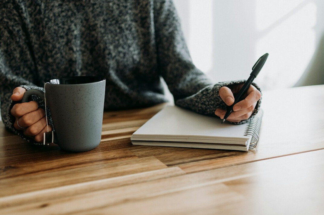 writer revising manuscript